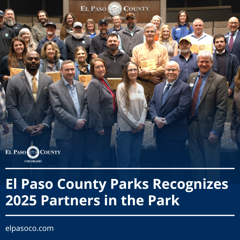 2025 Partners in the Park Graphic with a photo of a group of people who are the 2025 El Paso County Partners in the Park with a blue transparent overlay at the bottom and text reading El paso County Parks Recognizes 2025 Partners in the Park
