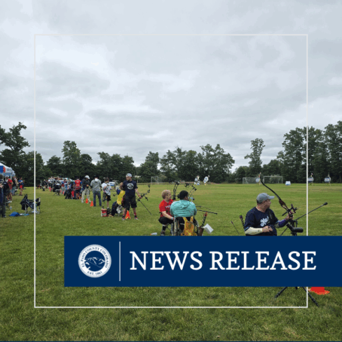 Square News Release graphic with an image of individuals participating in archery with a white line box and the El Paso County seal and text reading News Release