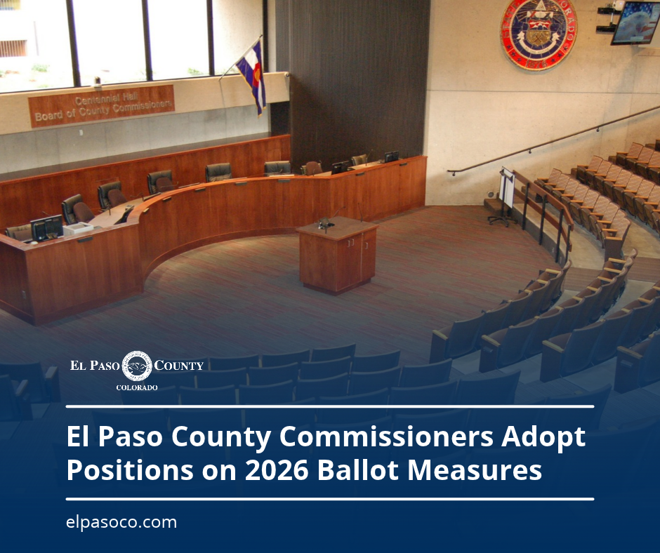 BoCC Ballot Measures (1) El Paso County Board of County Commissioners hearing room with empty seating and dais. A blue graphic overlay reads, “El Paso County Commissioners Adopt Positions on 2026 Ballot Measures,” with the El Paso County logo and elpasoco.com.