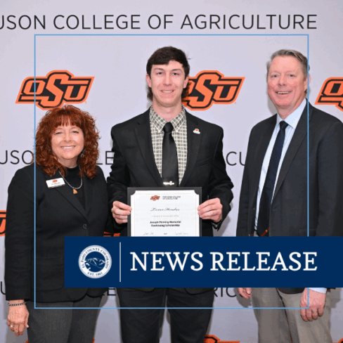 Photo of Trevor Hendrix receiving scholarship award from OSU college of agriculture representatives