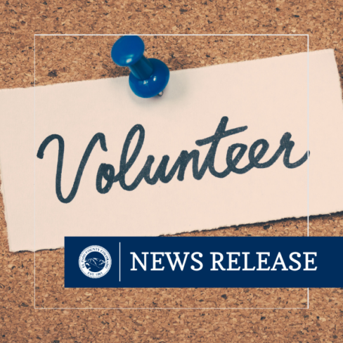 A photo of the bulletin board with a paper pinned to it. The paper reads "Volunteer."