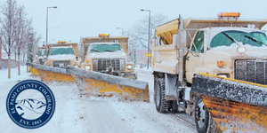 Active Snow Plow Trucks (1) Three snow plow trucks working to clear a road of snow