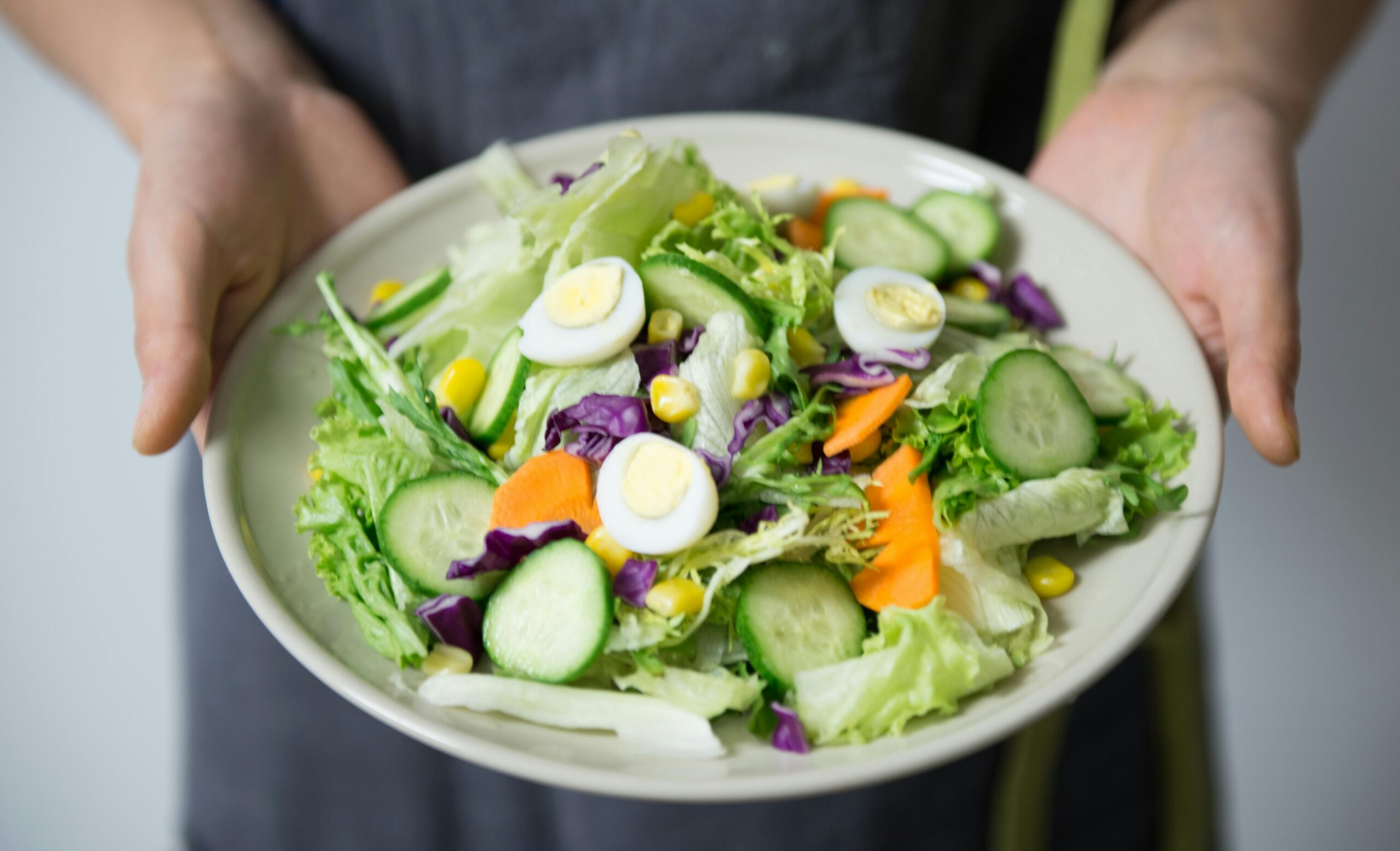 pexels-catscoming-406152 Person holding salad