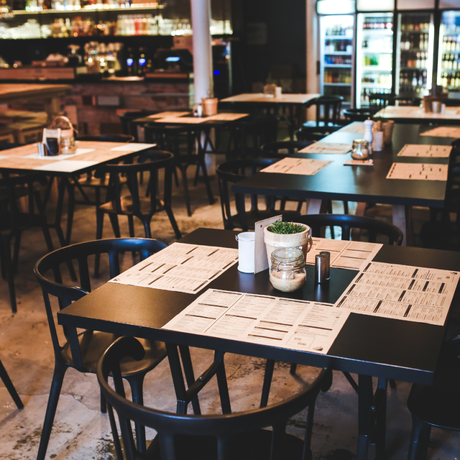 an empty restaurant with tables and chairs