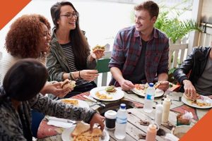 Friends gather for dinner.
