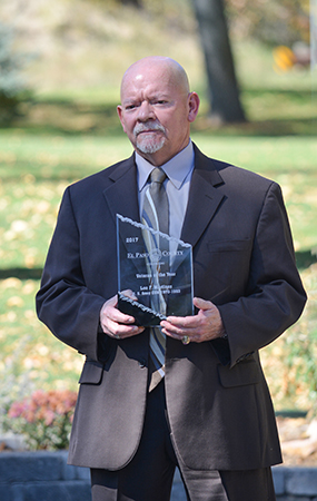 Leo Martinez, 2017 Veteran of the Year holding an award