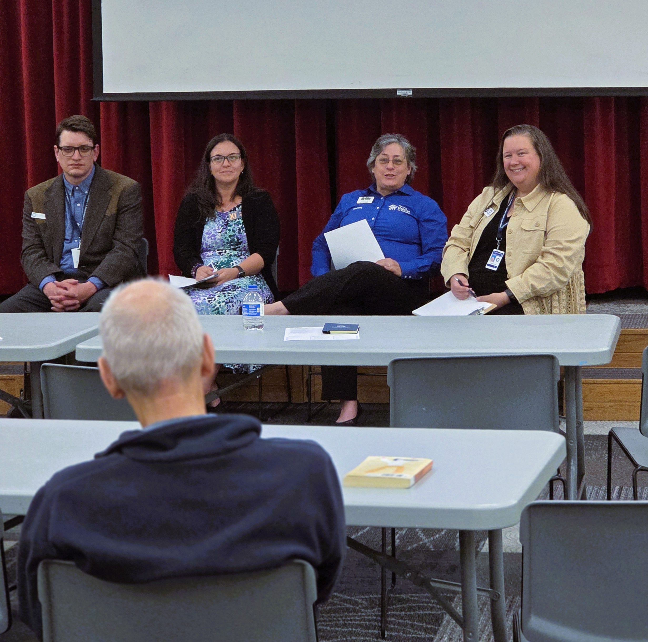 Expert panelists discuss local housing and economic partnerships at the June 2 event.