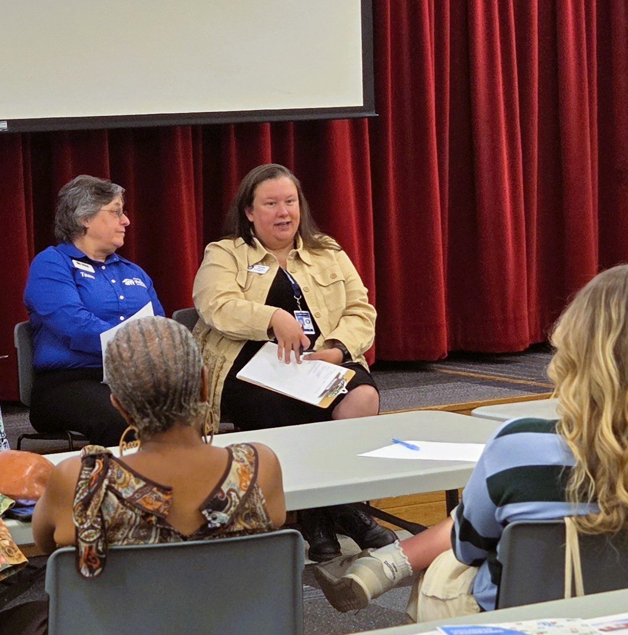 Randi Davis shares information about housing resources at the Community event.