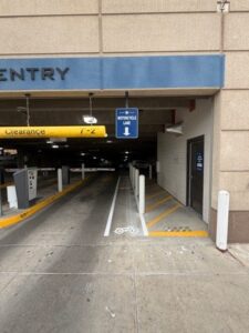 Costilla Garage Motorcycle Lane Entrance Costilla Garage Motorcycle Lane Entrance shown to the right of the vehicle entrance lane