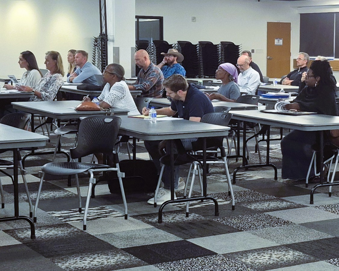 Attendees learn about affordable housing development at the August 14 event.
