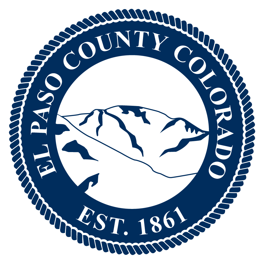 El Paso County Seal in dark blue with a mountain outline in the center. One the seal it reads El Paso County Colorado Est. 1861