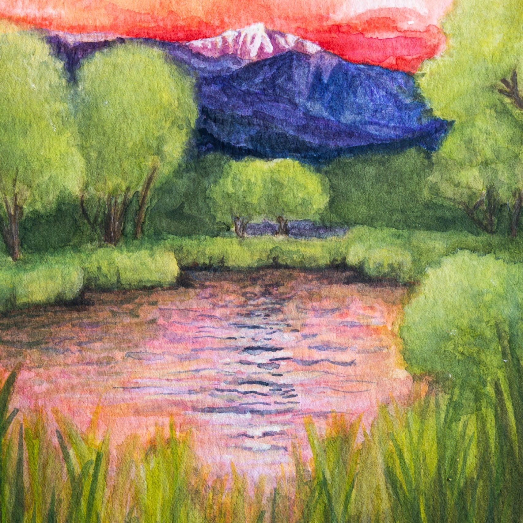 Watercolor painting of a pond with pikes peak in the background