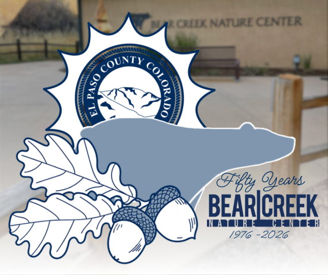Logo in foreground depicting El Paso County logo wthin a sun, the silhouette of a bear and the text Fifty Years Bear Creek Nature Center 1976-2026. Bear Creek Nature Center building in the background