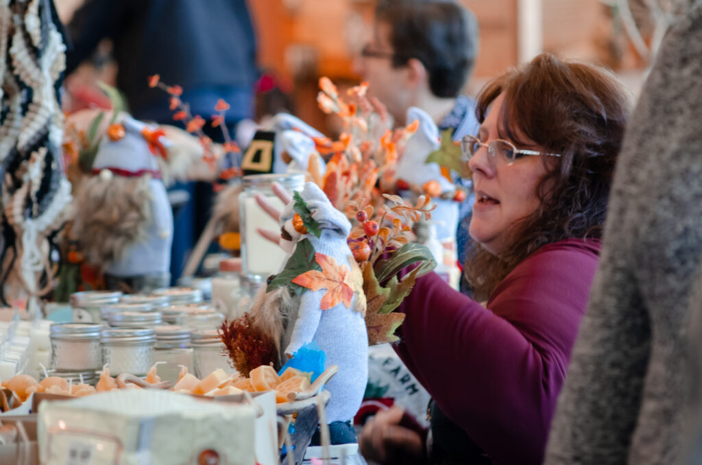 Holiday Craft Fair 2022 (1) A local artisan talks about their goods.