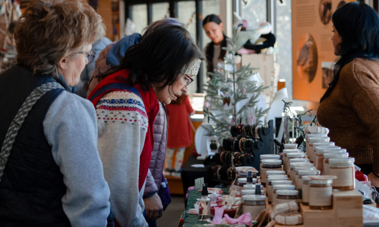 Holiday Craft Fair 2022 (3) A shopper looks closely at jams and spreads.