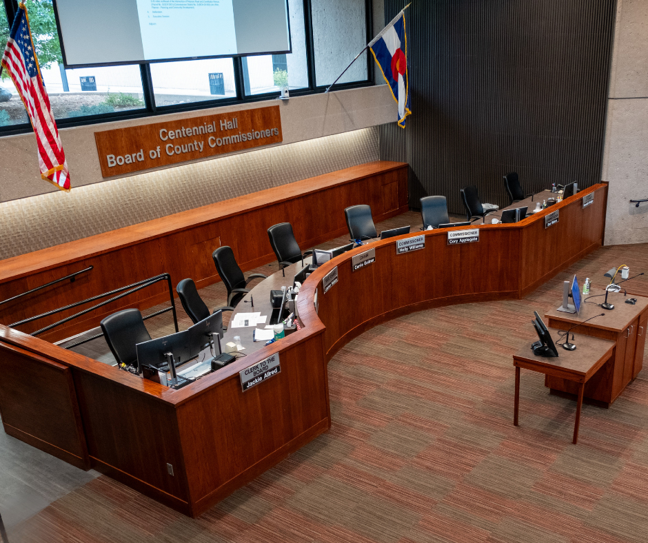 Centennial Hall auditorium over looking the Board of County Commissioners dais.